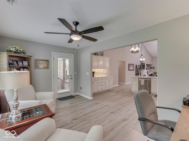 5351 Abbington Ave, Plainfield, IN 46168 - living area with light wood finished floors, ceiling fan, and a chandelier
