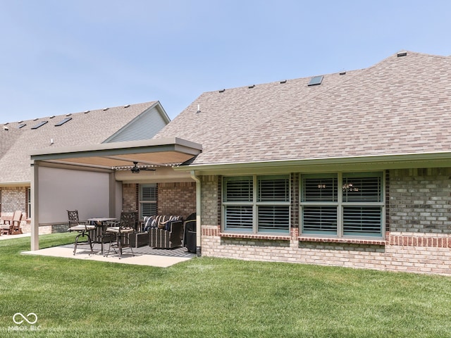5351 Abbington Ave, Plainfield, IN 46168 - back of house featuring brick siding, roof with shingles, a yard, and a patio