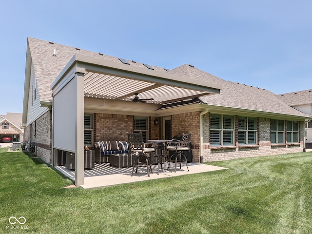 5351 Abbington Ave, Plainfield, IN 46168 - rear view of house featuring brick siding, a patio area, a lawn, ceiling fan, and a shingled roof