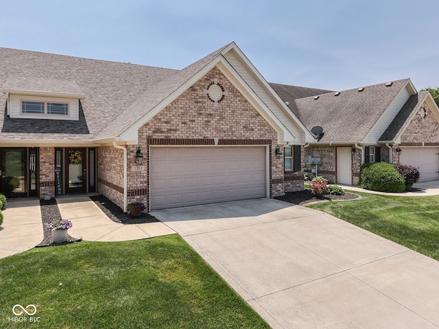 5351 Abbington Ave, Plainfield, IN 46168 - view of front of property featuring an attached garage, brick siding, driveway, and a shingled roof