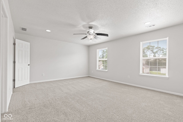 1903 Windy Hill Ln, Indianapolis, IN 46239 - carpeted spare room featuring a textured ceiling, ceiling fan, and recessed lighting