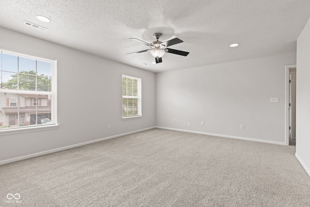 1903 Windy Hill Ln, Indianapolis, IN 46239 - carpeted spare room featuring a ceiling fan, healthy amount of natural light, a textured ceiling, and recessed lighting