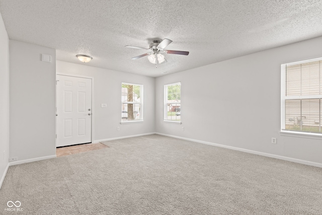 1903 Windy Hill Ln, Indianapolis, IN 46239 - spare room with ceiling fan, carpet floors, and a textured ceiling