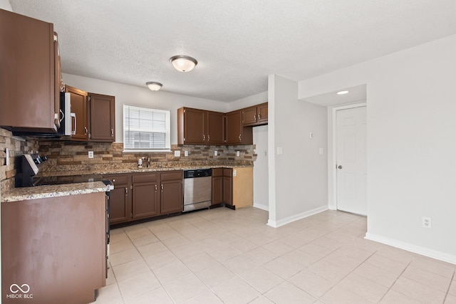 1903 Windy Hill Ln, Indianapolis, IN 46239 - kitchen with stainless steel dishwasher, backsplash, white microwave, light stone countertops, and light tile patterned floors