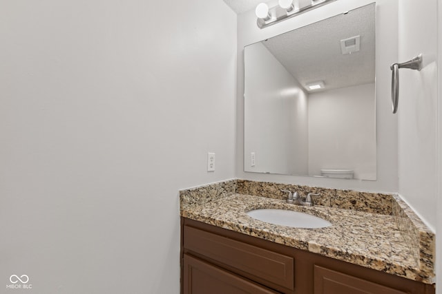1903 Windy Hill Ln, Indianapolis, IN 46239 - bathroom featuring a textured ceiling and vanity