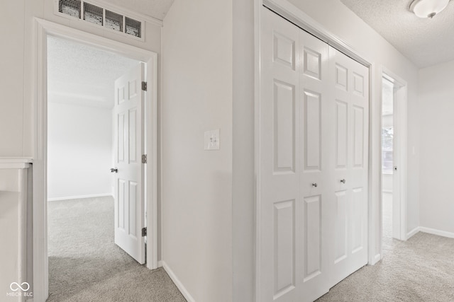 1903 Windy Hill Ln, Indianapolis, IN 46239 - corridor with carpet floors and a textured ceiling
