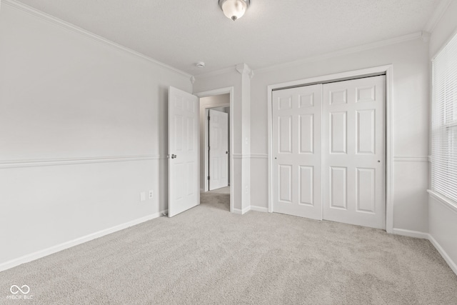 1903 Windy Hill Ln, Indianapolis, IN 46239 - unfurnished bedroom featuring crown molding, carpet, and a closet