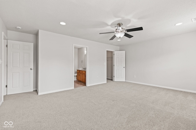 1903 Windy Hill Ln, Indianapolis, IN 46239 - unfurnished bedroom featuring light carpet, connected bathroom, a spacious closet, recessed lighting, and ceiling fan