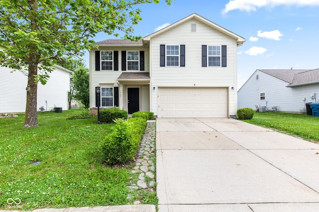 1903 Windy Hill Ln, Indianapolis, IN 46239 - traditional home featuring an attached garage, driveway, and a front lawn