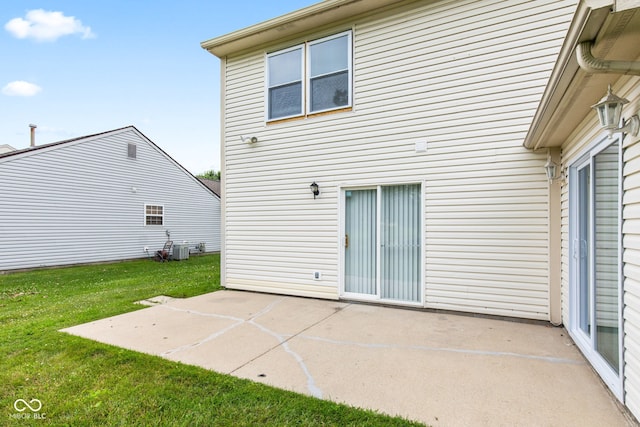 1903 Windy Hill Ln, Indianapolis, IN 46239 - rear view of property with a patio and a yard