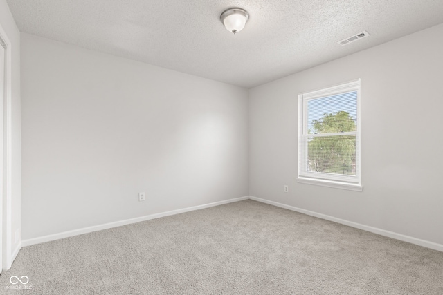 1903 Windy Hill Ln, Indianapolis, IN 46239 - spare room with carpet and a textured ceiling