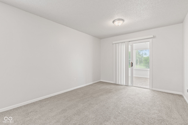 1903 Windy Hill Ln, Indianapolis, IN 46239 - carpeted spare room with a textured ceiling and baseboards