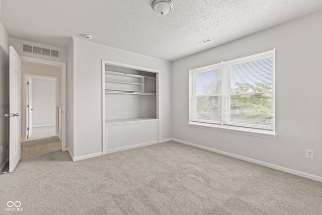 1903 Windy Hill Ln, Indianapolis, IN 46239 - unfurnished bedroom with carpet flooring, a textured ceiling, and a closet