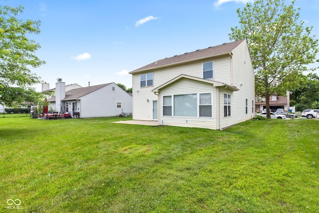 1903 Windy Hill Ln, Indianapolis, IN 46239 - rear view of house featuring a lawn