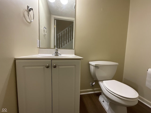 2853 S Walnut Street Pike, Bloomington, IN 47401 - bathroom with wood finished floors, vanity, and a textured ceiling