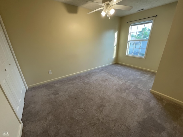 2853 S Walnut Street Pike, Bloomington, IN 47401 - spare room featuring carpet flooring and a ceiling fan