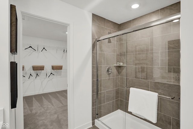 19801 Moorpark Lndg, Noblesville, IN 46062 - full bathroom featuring a walk in closet, a stall shower, and recessed lighting