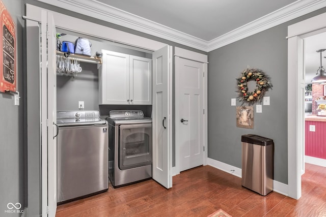 900 W Busby St, Lebanon, IN 46052 - laundry room with cabinet space, wood finished floors, separate washer and dryer, and crown molding