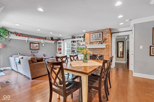 900 W Busby St, Lebanon, IN 46052 - dining room with ornamental molding, light wood-type flooring, recessed lighting, and a fireplace