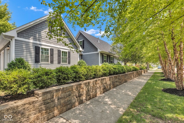 900 W Busby St, Lebanon, IN 46052 - view of home's exterior featuring a lawn