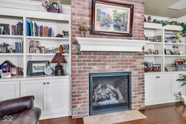 900 W Busby St, Lebanon, IN 46052 - living room with a fireplace, wood finished floors, and built in shelves