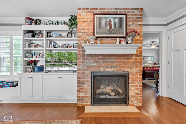 900 W Busby St, Lebanon, IN 46052 - unfurnished living room featuring ornamental molding, wood finished floors, a fireplace, and ceiling fan