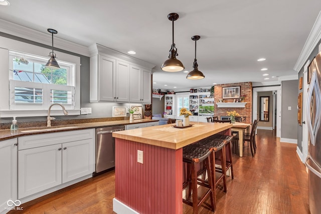 900 W Busby St, Lebanon, IN 46052 - kitchen featuring stainless steel dishwasher, wooden counters, a breakfast bar, recessed lighting, and dark wood finished floors