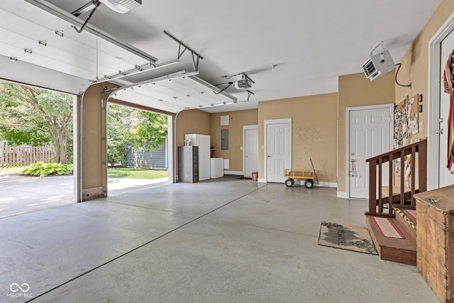 900 W Busby St, Lebanon, IN 46052 - garage featuring a garage door opener and electric panel
