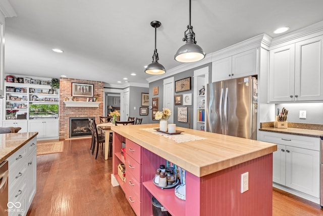 900 W Busby St, Lebanon, IN 46052 - kitchen featuring freestanding refrigerator, butcher block countertops, open shelves, white cabinetry, and open floor plan