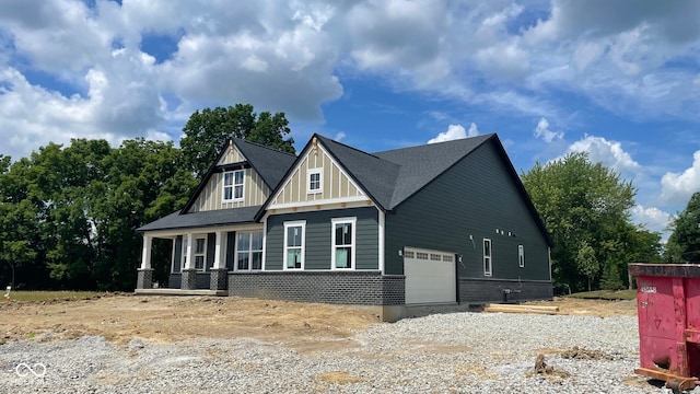 1960 Delp Ct, Avon, IN 46123 - view of front of house featuring board and batten siding, a garage, and driveway