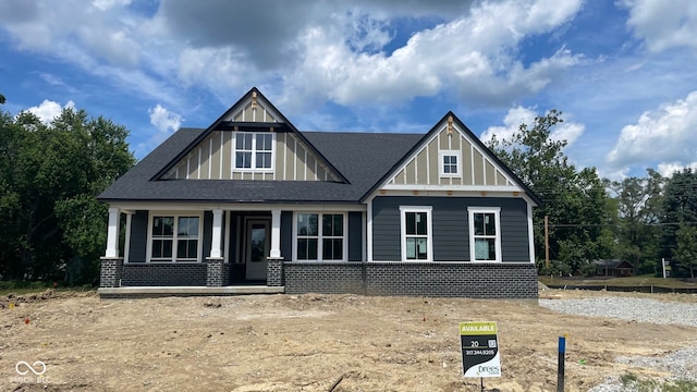 1960 Delp Ct, Avon, IN 46123 - craftsman-style house with covered porch, roof with shingles, and brick siding