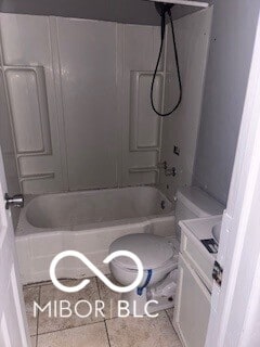 1724-1726 N Somerset Ave, Indianapolis, IN 46222 - full bathroom featuring vanity, tub / shower combination, toilet, and tile patterned flooring