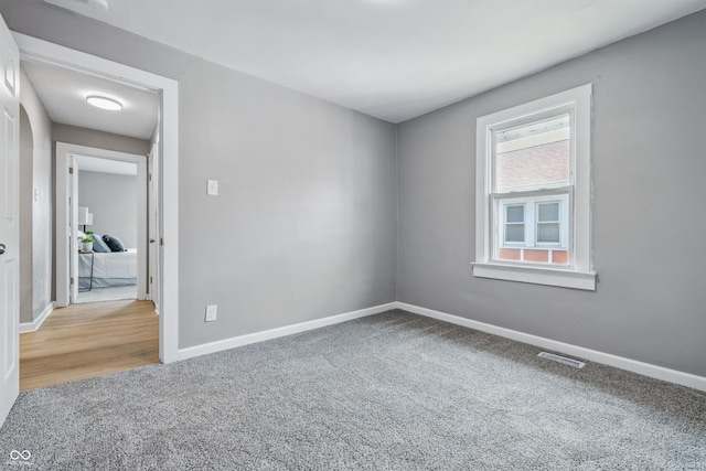 3906 Fletcher Ave, Indianapolis, IN 46203 - carpeted spare room featuring baseboards