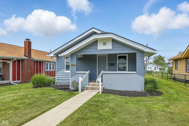 3906 Fletcher Ave, Indianapolis, IN 46203 - view of front of property featuring covered porch and brick siding