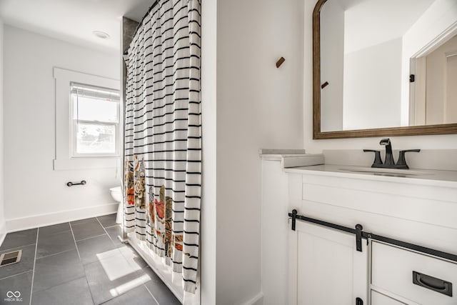 805 N Temple Ave, Indianapolis, IN 46201 - full bathroom featuring vanity, curtained shower, and tile patterned flooring