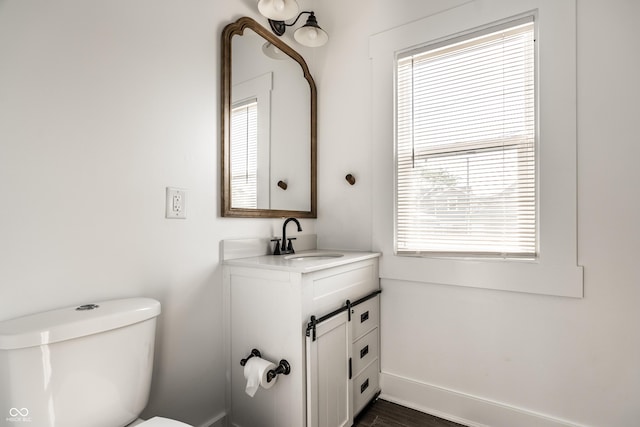 805 N Temple Ave, Indianapolis, IN 46201 - half bath with vanity, plenty of natural light, and wood finished floors