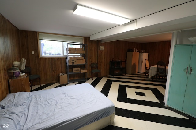 1713 Boca Raton Blvd, Kokomo, IN 46902 - bedroom featuring wood walls and freestanding refrigerator