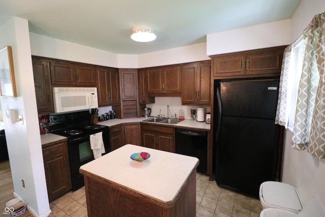 1713 Boca Raton Blvd, Kokomo, IN 46902 - kitchen with black appliances, a sink, light countertops, and a kitchen island