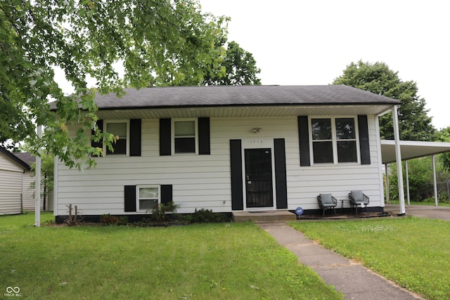 1713 Boca Raton Blvd, Kokomo, IN 46902 - split foyer home with a front lawn, a carport, and roof with shingles