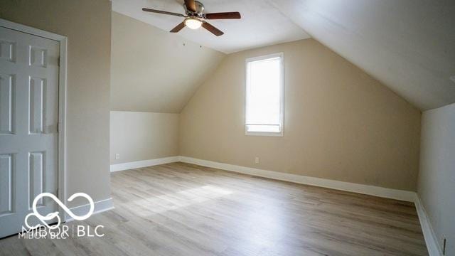 352 W 28th St, Indianapolis, IN 46208 - additional living space featuring wood finished floors, a ceiling fan, baseboards, and lofted ceiling