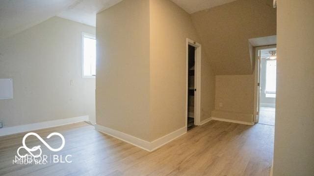 352 W 28th St, Indianapolis, IN 46208 - bonus room with lofted ceiling, wood finished floors, and baseboards