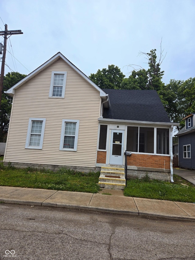 352 W 28th St, Indianapolis, IN 46208 - view of front of property with entry steps and a sunroom
