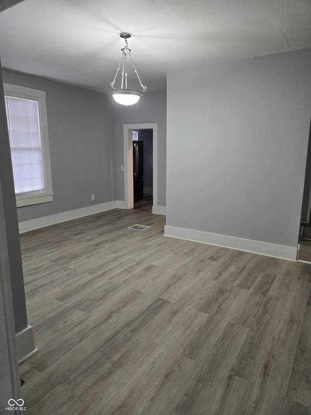 352 W 28th St, Indianapolis, IN 46208 - spare room featuring wood finished floors and baseboards