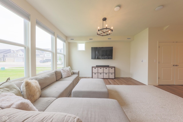 640 Axford Bay Dr, Westfield, IN 46074 - living room with wood finished floors, a chandelier, and baseboards