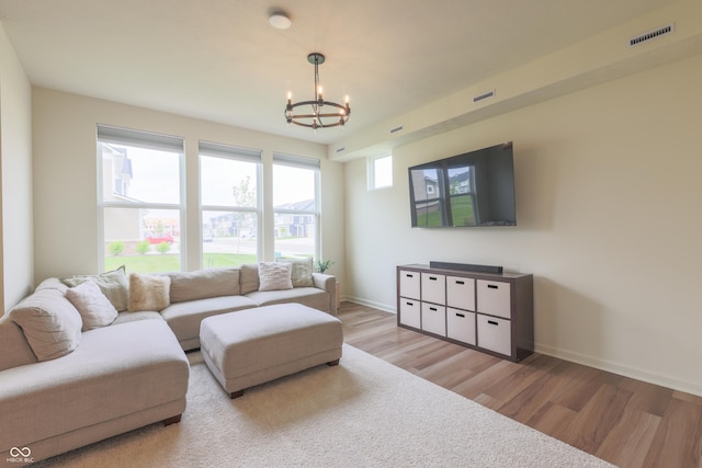 640 Axford Bay Dr, Westfield, IN 46074 - living area with a chandelier, wood finished floors, and baseboards