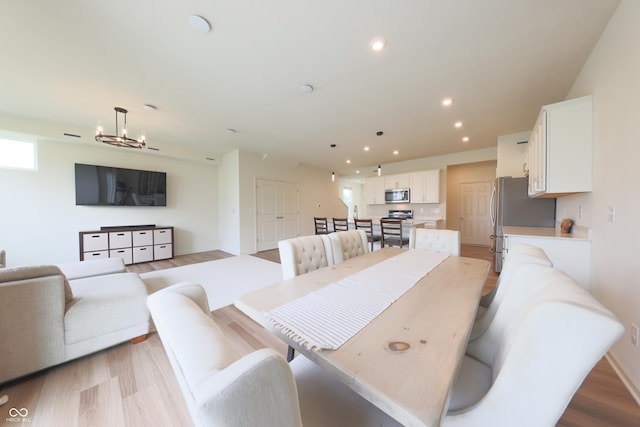 640 Axford Bay Dr, Westfield, IN 46074 - dining space with light wood-style floors, recessed lighting, and a chandelier