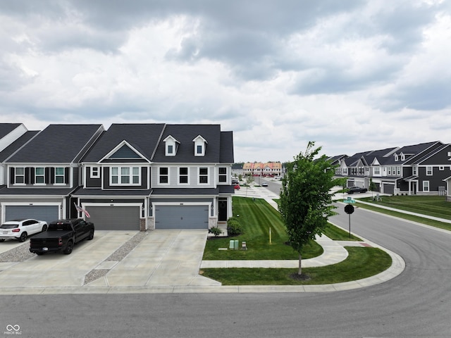 640 Axford Bay Dr, Westfield, IN 46074 - townhome / multi-family property with an attached garage, driveway, a residential view, and a front yard