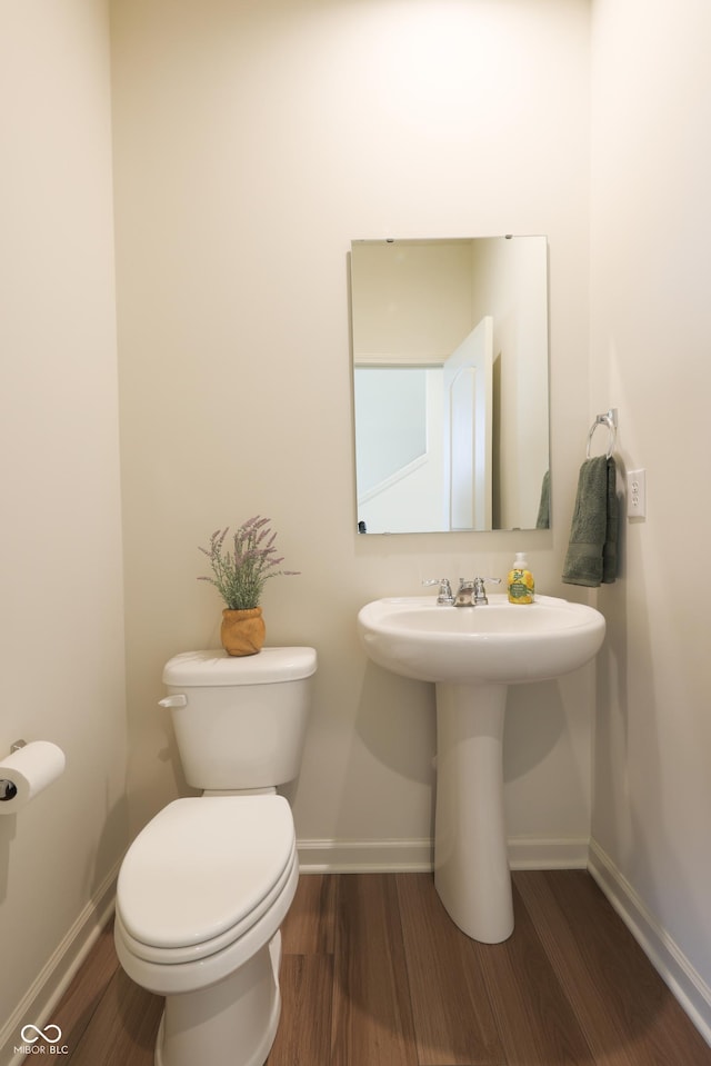 640 Axford Bay Dr, Westfield, IN 46074 - half bathroom featuring wood finished floors, baseboards, and toilet