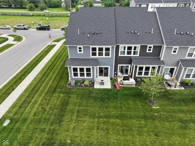 640 Axford Bay Dr, Westfield, IN 46074 - rear view of property featuring a shingled roof, a patio, and a yard