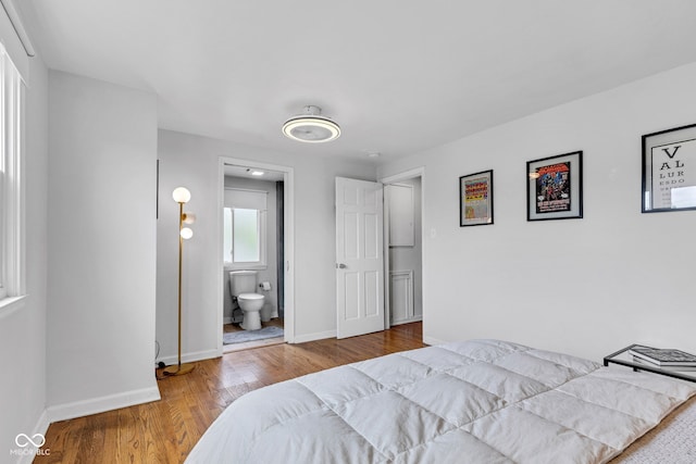 1618 Villa Ave, Indianapolis, IN 46203 - bedroom with baseboards, wood finished floors, and ensuite bath